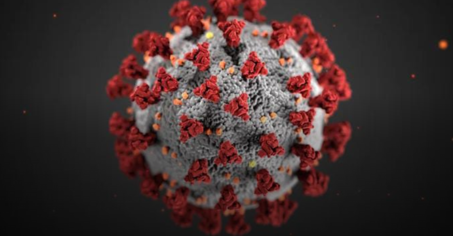 Breaking news image showing a hospital environment with medical staff in protective gear